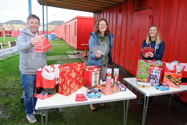 Love Falkirk members have bought £2000 of gift cards - courtesy of donations - from Falkirk Delivers to help struggling families this Christmas. From left: Andrew McNinch, senior pastor; Ruth Allen, pantry worker; and Lyndsey Henderson, coordinator. Picture: Michael Gillen.
