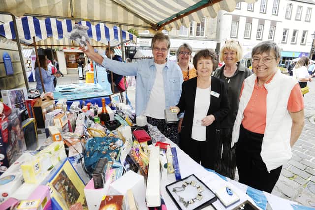 Strathcarron Hospice stall  and volunteers at last year's Charities Day. Pic: Alan Murray