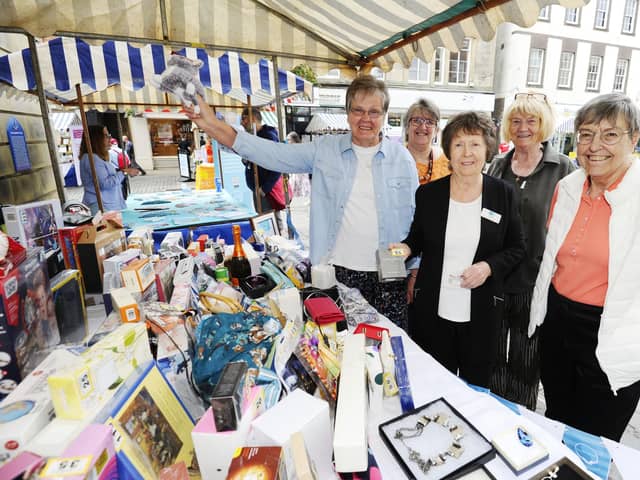 Strathcarron Hospice stall  and volunteers at last year's Charities Day. Pic: Alan Murray