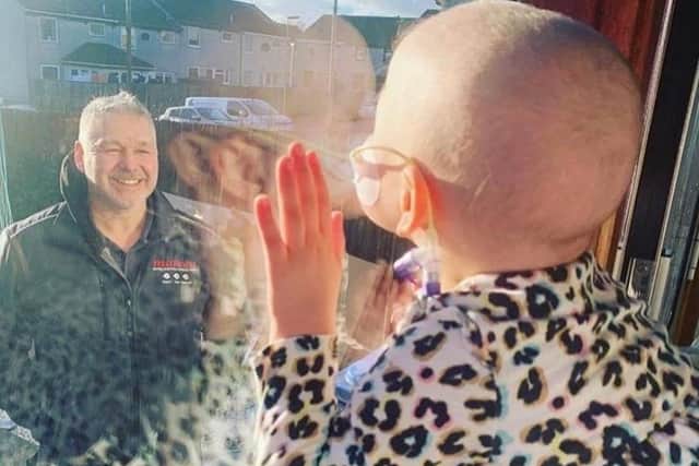 The picture of Stenhousemuir girl Mila Sneddon blowing a kiss to dad Scott chosen to feature among the final 100 of the Duchess of Cambridge's Hold Still project. Contributed.
