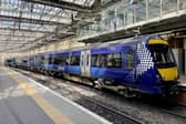 A ScotRail train waiting at the platform at Edinburgh's Waverley Station. ScotRail's new timetable, which will see almost 700 fewer train services a day across Scotland, begins today whilst the deadlock over driver pay continues. Picture date: Monday May 23, 2022.