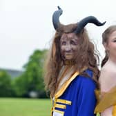 The Beast played by Roan Buckham and Belle played by Bethany Spowart
