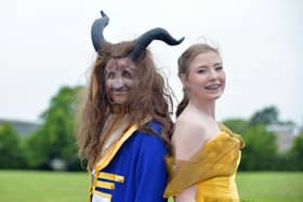 The Beast played by Roan Buckham and Belle played by Bethany Spowart