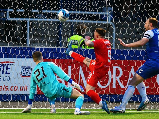 Falkirk go ahead at Montrose through Kai Kennedy, with Jordan Allan following in to make sure of goal (Pics Michael Gillen)