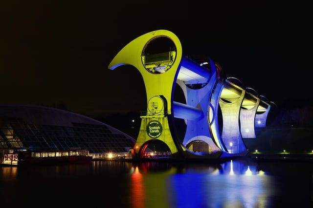 Falkirk Wheel lit up blue and yellow in the colours of Ukraine's flag