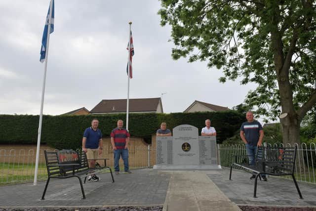 Carronshore Heritage Forum members beside completed Carronshore War Memorial - Gordon Walker, committee member; Colin Wilson, treasurer; Craig Martin, secretary; John McLuckie, chairman and Stewart Wright, committee member.