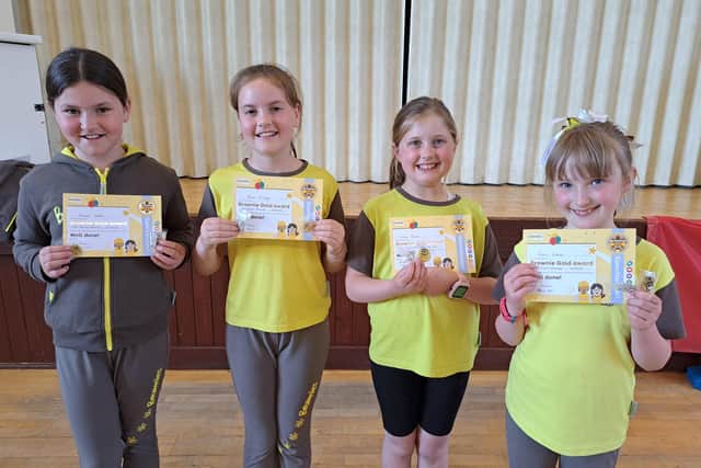 Four girls from 2nd Polmont Brownies receive their Gold award, left to right, Hannah Easton, Honor McHugh, Emma Rowan and Emma Clarke. Pic: Contributed