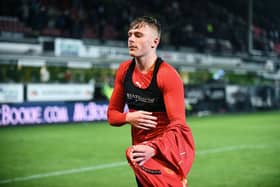 27-12-2024. Picture Michael Gillen. DUNFERMLINE. East End Park. Dunfermline Athletic FC v Falkirk FC. Season 2024 - 2025. SPFL William Hill Championship. Match Day 19. Luke Graham 22 hands his shirt to a Falkirk fan. Graham has been recalled by parent club Dundee FC.