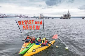 Activists took to kayaks to get their environmental message across at the Ineos oil terminal
(Picture: Mark Richards - Aurora Imaging)