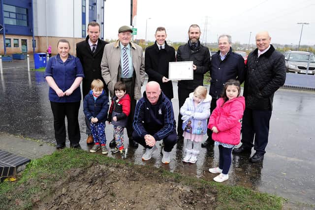 Gillies (standing, third in from left) back in 2015 at the Falkirk Stadium as an ambassador of the hospice helping plant a snowdrop garden with members of the club's board of directors, and then first team manager Peter Houston