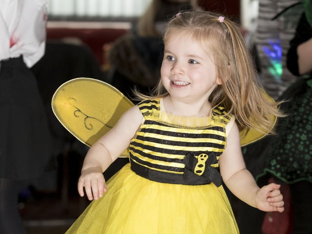 This young girl is busy having a great time at the party.
