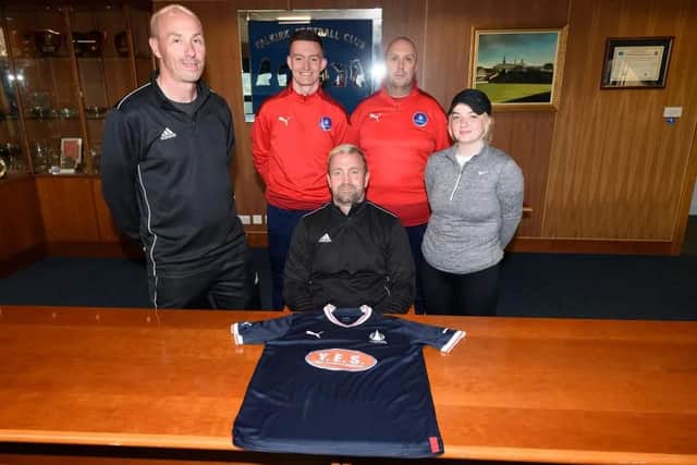 New head coach of Falkirk Women Craig Tully (sat down) pictured alongside his coaching team (Photo: Ian Sneddon)