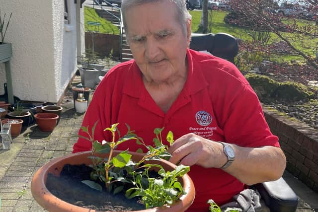 Eddie Newton planting tubs at Strathcarron Hospice. Pic: Contributed