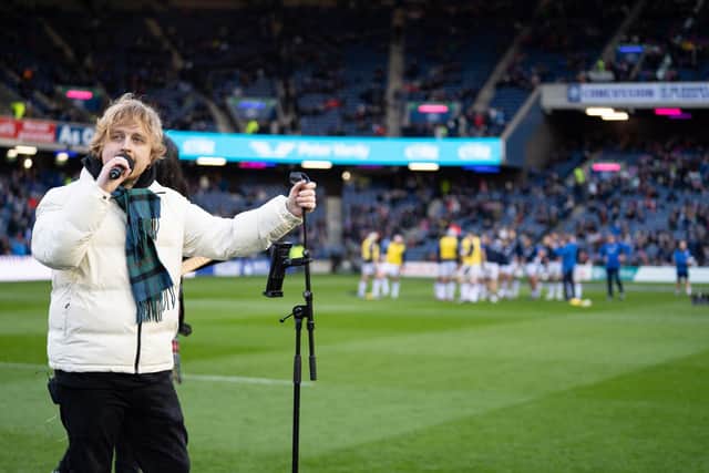 Craig and his band took to the pitch ahead of kick off in the Scotland v Wales match. (Pic: Emma Gray)