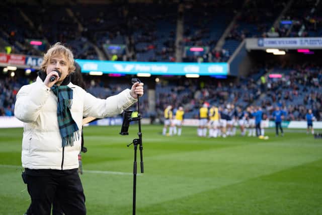 Craig and his band took to the pitch ahead of kick off in the Scotland v Wales match.  (Pic: Emma Gray)