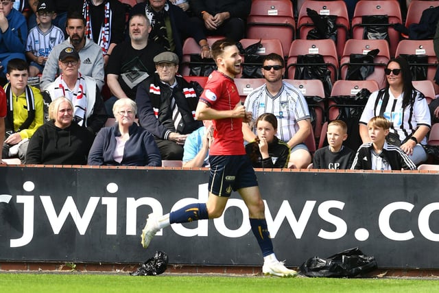 Ross MacIver accepts the adulation of fans after his early goal at East End Park