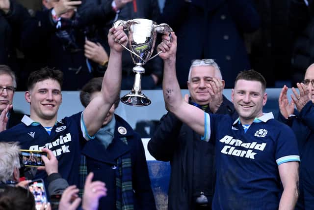 EDINBURGH, SCOTLAND - FEBRUARY 01: Co-Captains Rory Darge and Finn Russell of Scotland lift the Cuttitta Cup after being presented with it from HRH Princess Anne, Patron of the Scottish Rugby Union, (obscured) during the Guinness Six Nations 2025 match between Scotland and Italy at Scottish Gas Murrayfield on February 01, 2025 in Edinburgh, Scotland. (Photo by Stu Forster/Getty Images)