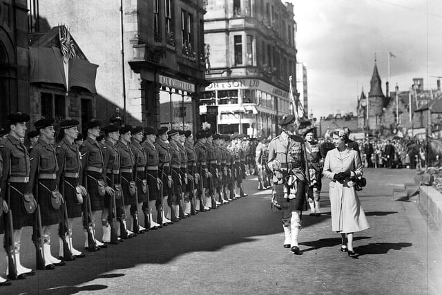 The Queen inspecting the guard of honour of the 7th Battalion Argyll and Sutherland Highlanders in Falkirk's Newmarket Street.