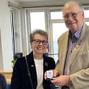 RNLI chairwoman Janet Legrand was delighted to present Tom Robertson with his 50 years’ service medal.