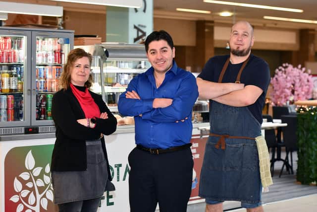 Takings from Valentine's Day at The Allotment Cafe are being donated to help Turkish families left homeless following the earthquake last week. Pictured, from left: Emel Canturk, barista; Erdal Ozer, owner and Arturs Silovs, kitchen manager.  (Pic: Michael Gillen)