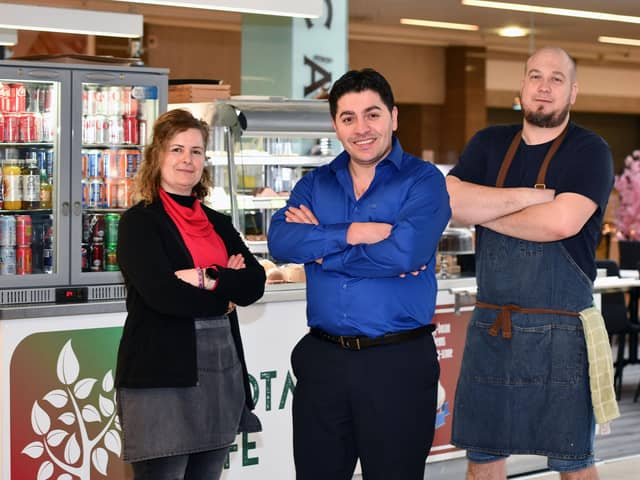 Takings from Valentine's Day at The Allotment Cafe are being donated to help Turkish families left homeless following the earthquake last week. Pictured, from left: Emel Canturk, barista; Erdal Ozer, owner and Arturs Silovs, kitchen manager.  (Pic: Michael Gillen)