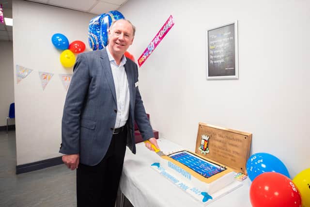 Chief Executive Neil Brown cutting the 50th birthday cake