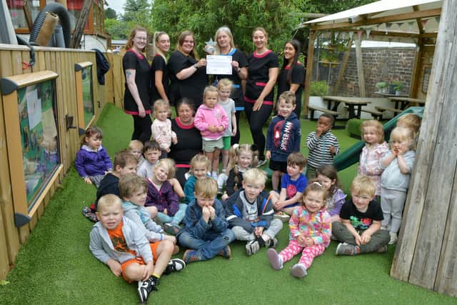 Wellside Kindergarten staff and children celebrate winning Scottish Nursery of the Year at the National Day Nurseries Association awards
(Picture: Michael Gillen, National World)