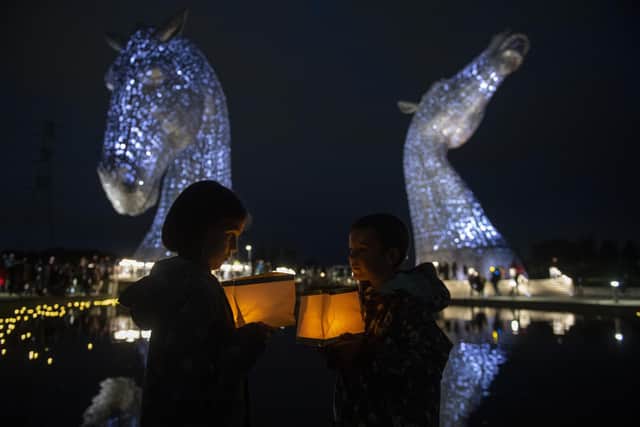 Ruby and Sonny Wallace take part in a service of reflection to honour Queen Elizabeth II at The Kelpies. Picture: Lesley Martin/PA Wire