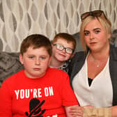 Natasha Rae with sons Ryley and Barry McGuckin, and partner Chris Bell - they had issues with Ryley's passport at Prestwich Airport when Ryanair refused to let them fly. Pic: Michael Gillen