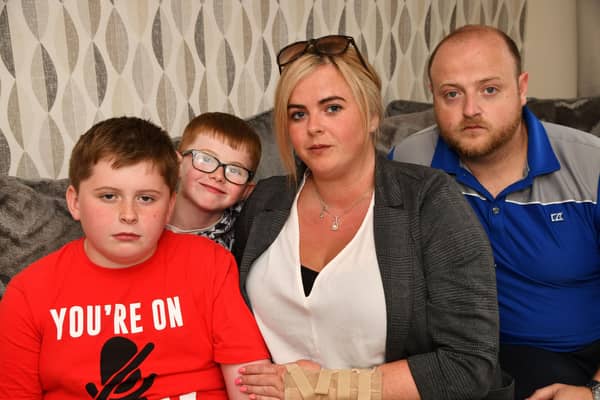 Natasha Rae with sons Ryley and Barry McGuckin, and partner Chris Bell - they had issues with Ryley's passport at Prestwich Airport when Ryanair refused to let them fly. Pic: Michael Gillen