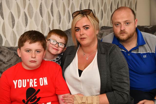 Natasha Rae with sons Ryley and Barry McGuckin, and partner Chris Bell - they had issues with Ryley's passport at Prestwich Airport when Ryanair refused to let them fly. Pic: Michael Gillen