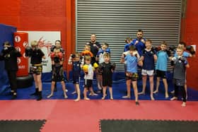 Instructors Ross Cameron (back centre) and Ross McMinn with some of the junior members of Forth Tiger Muay Thai at the recreation centre.