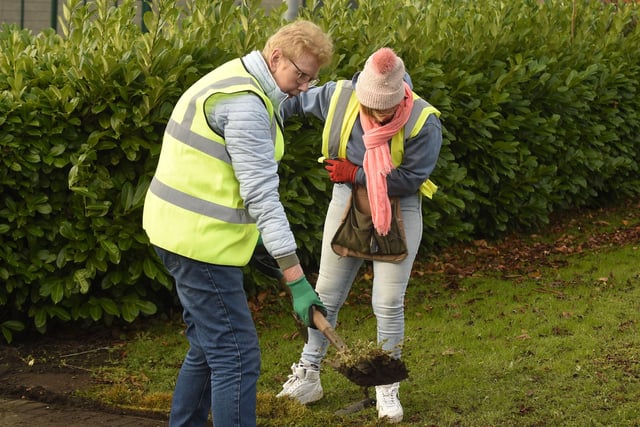 Volunteers hard at work clearing away litter at the memorial