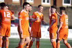 Syngenta players celebrate after the final whistle (Pictures: Alan Murray)