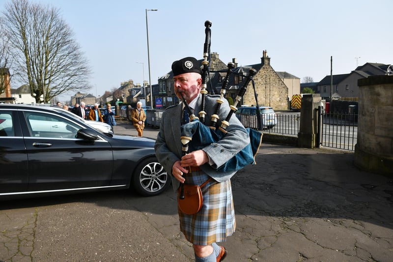Piper Neil Clark piper leads the family of James Finlayson into the Dobbie Hall.
