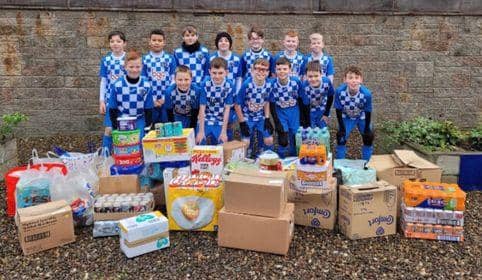 Central Football Academy donate a day's worth of food to Strathcarron Hospice
