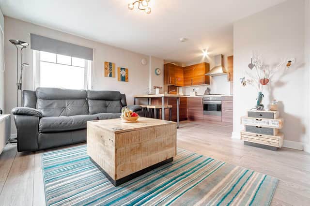 The open living room and kitchen space at 12 The Beech Tree, Linlithgow.