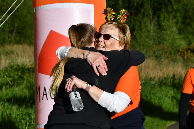 Hugs at the finish line.