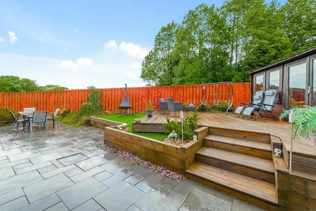 The wraparound suntrap back garden is enveloped on three sides by timber fencing, offering the ideal sanctuary for any family.