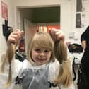 Langlees Primary School pupil Robin Dignan (5) gets her lovely locks  chopped off for the Little Princess Trust