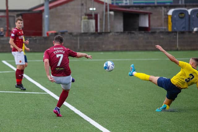 Ross Forbes shoots at goal for Stenny