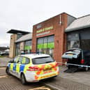 Police attended after the car crashed into the former Strathcarron Hospice shop in Stenhousemuir (Picture: Michael Gillen, National World)