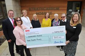 Handing over a cheque in Martin Strang's name to Strathcarron Hospice -  Colin Read, BNI executive director Scotland South and East; Dionne Read, BNI executive director Scotland South and East; Renee McBride, BNI member; Sylvia Stevenson, BNI member; Michelle Howden, sister of Martin Strang; Margaret Strang, mother of Martin Strang; Malcolm Strang, father of Martin Strang and Alisa Herd, Strathcarron Hospice communications manager