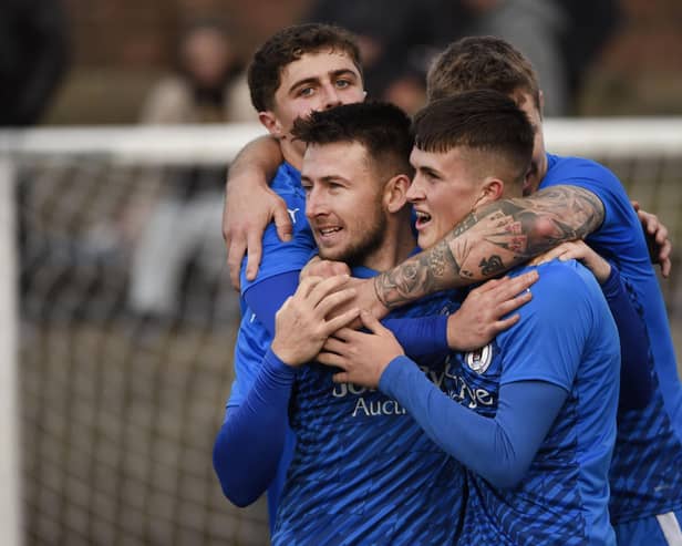 Bo’ness United ace Ryan Stevenson is mobbed by his team-mates after scoring his side’s third goal against Darvel on Saturday at Newtown Park (Pictures by Alan Murray)