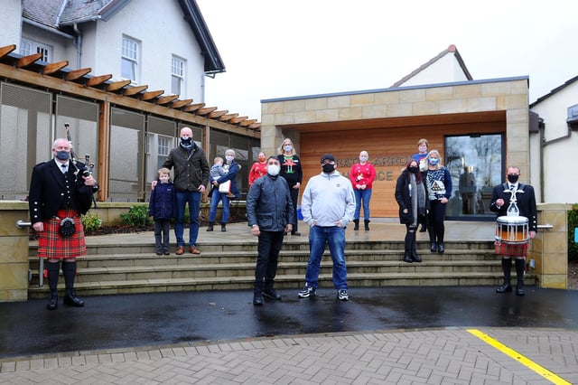 Producer Barry Frame (front centre right) made a Christmas cover featuring solely Denny singers and musicians which is raising funds for Strathcarron Hospice, Fankerton. Picture: Michael Gillen.