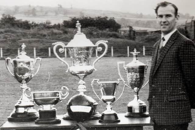 1965 and 2002 were the most successful in the club's history, Davie here with the trophies in 1965.