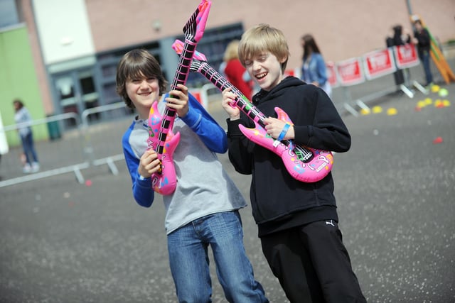Inflatable pink guitars making some noise.