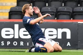 Sean Mackie slides as he celebrates scoring Falkirk’s second goal against Airdrieonians last weekend during a 2-0 league victory (Photo: Michael Gillen)