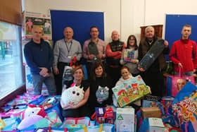 Kersiebank Community Project toy appeal, pictured: Gary Duncan, Stuart Hunter, John Moran, Cliff Bowen and Nicola Kirkham of Ineos, with Donna Murray, Leeanne Robb and Reece Temporal of KCP. Pic: LDR