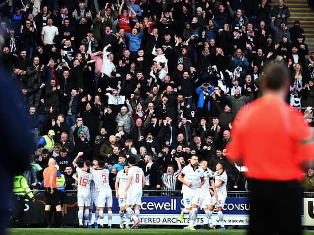 Falkirk boss John McGlynn (out of focus) watches on as Dunfermline celebrate their goal in the 1-0 win on Saturday (Pics by Michael Gillen)